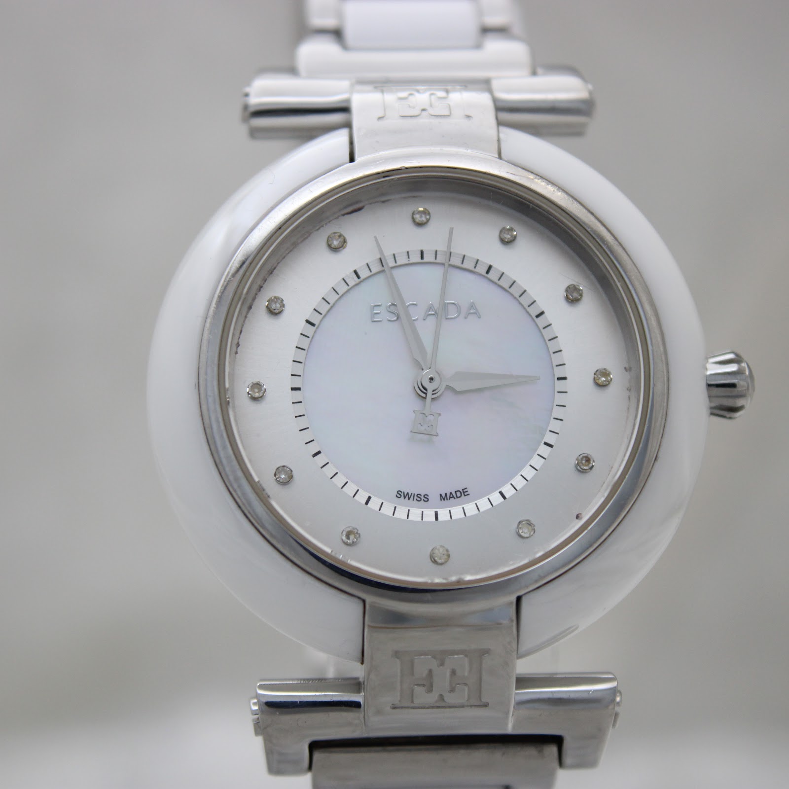 Close-up front view of the Escada Lauren watch dial, clearly showing the mother-of-pearl texture, crystal indices, and Escada logo.