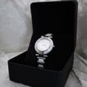 The Escada Lauren watch elegantly displayed inside a plain black presentation box with a velvet cushion.