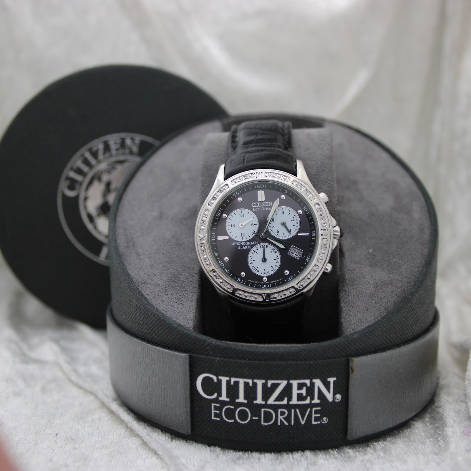 Citizen Eco-Drive watch displayed in its original branded box, open.