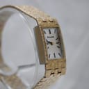 Another angled side view of the vintage Bulova watch, highlighting the rectangular case and integrated bracelet design.