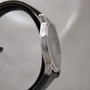 Another side profile view of the polished stainless steel case and crown of the Raymond Weil 5571 watch.