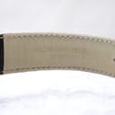 Interior view of the black leather strap showing "Raymond Weil Genève" embossed.