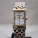 Front view of Raymond Weil Tango 5970 bi-tone watch with white mother-of-pearl dial and gold-tone Roman numerals.
