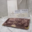 Original Raymond Weil branded wallet and official paperwork, including the certificate of origin and guarantee card dated 17-1-1985 from SWAG Jewellers.