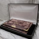 The Raymond Weil original wallet and paperwork neatly arranged inside a London Watch Market black presentation box.