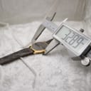 Digital caliper measuring the watch case diameter at 32.89mm, with the watch visible in the background.