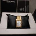 Front view of the watch resting on a cushion inside its original Raymond Weil presentation box