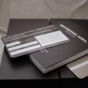Close-up of the Raymond Weil instruction booklet and authenticity card, showing fields for reference and serial numbers