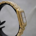 Angled side view of the gold Raymond Weil Tango watch, highlighting the rectangular case and bracelet links