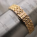 The gold watch bracelet displayed on a wrist sizing mandrel, indicating a circumference of approximately 172mm