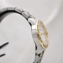 Another side view of the Bulova watch, showing the curved lugs and two-tone bracelet.