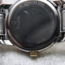 Close-up of the watch case back showing "Bulova", model "C637452", "11914320", "stainless steel" and "water resistant" engravings.