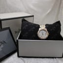 The Bulova watch displayed in its original presentation box with cushion and booklet.