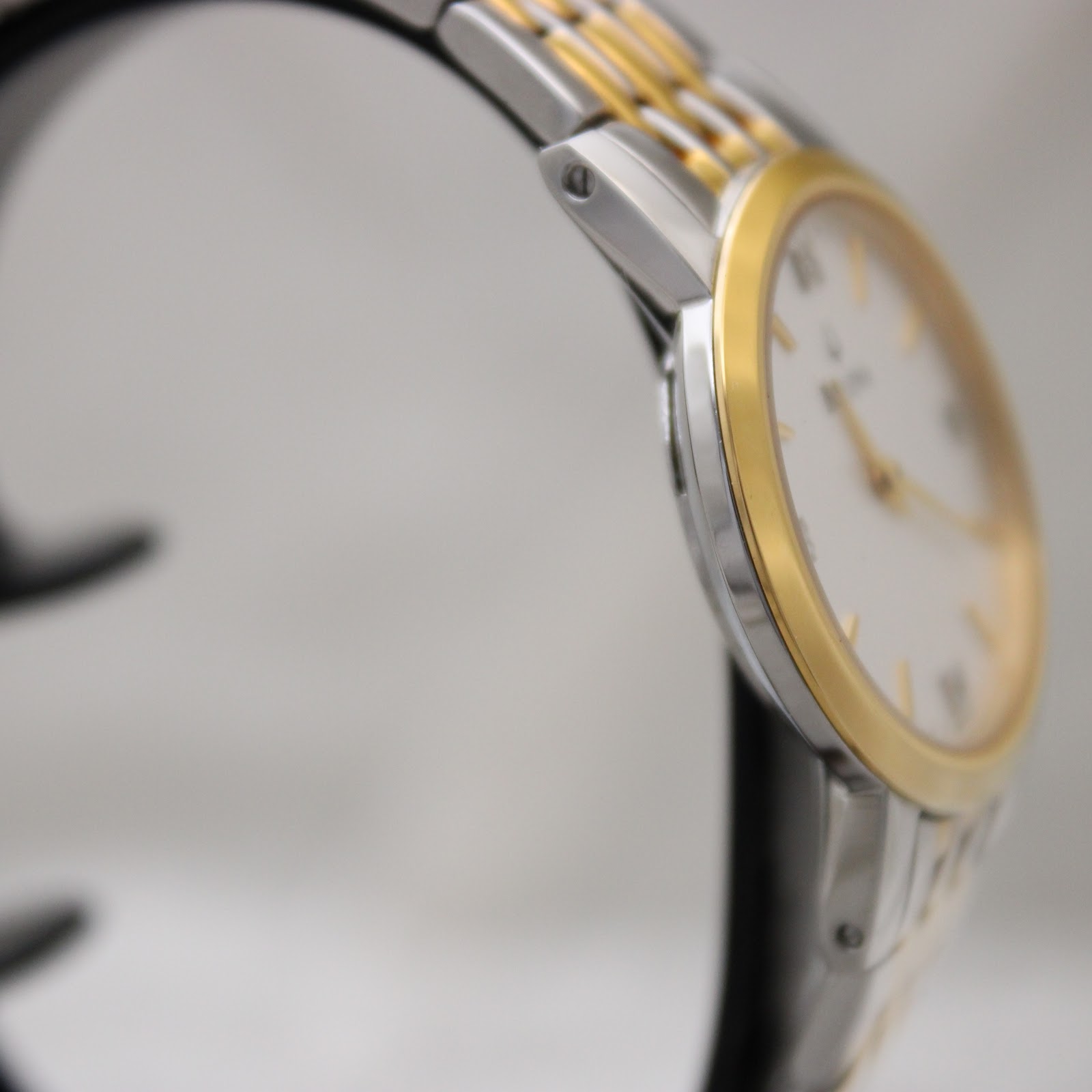 Another side profile view of the Bulova watch, highlighting the two-tone bracelet and case lines.