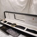The Raymond Weil 9124 watch displayed within its original black presentation box, accompanied by the Raymond Weil booklet.