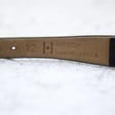 Close-up of the underside of the black leather strap, embossed with "12" and "HIRSCH DIAMOND LEATHER", indicating the lug width and strap type.
