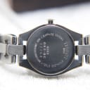 Close-up of the stainless steel case back of the Tissot G333, showing 'TISSOT 1853', 'G333 QKS-BC 11264', 'SAPPHIRE CRYSTAL', and 'WATER RESISTANT 30M'.