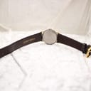 Rear view of the Montine watch, showing the plain case back and the 'GENUINE LEATHER' text on the strap.