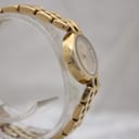 Side profile of the Raymond Weil gold watch, highlighting the case and bracelet construction.