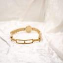 Rear view of the gold electroplated bracelet, showing the fold-over clasp mechanism.