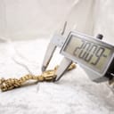 Close-up of a digital caliper measuring the Raymond Weil watch case, displaying a diameter of 32.32mm.