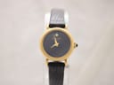 Front view of Raymond Weil Genève 544 gold-plated watch with black dial and single diamond-style marker.