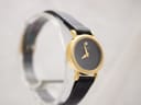Another angled view of the Raymond Weil 544 watch, highlighting the minimalist dial and gold case.