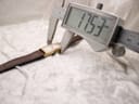 Digital caliper measuring the width of the watch case, displaying 17.53 mm