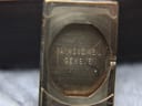 Close-up of the inside of the watch case back, showing "RAYMOND WEIL GENEVE" engraved