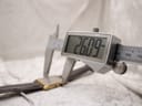 Digital caliper measuring the case width (excluding crown) of the watch, showing a precise reading of 26.09 mm.