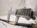 Digital caliper measuring the case length (lug-to-lug) of the watch, showing a precise reading of 34.41 mm.
