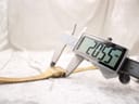 Digital caliper measuring the watch case diameter at 20.5 mm, confirming the size.