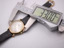 View of the Raymond Weil watch with a digital caliper measuring the case diameter at 33.00mm.