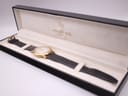 The Raymond Weil 9833 watch resting inside its original black Raymond Weil presentation box with cream lining.