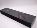Top-down view of the closed original black Raymond Weil presentation box with branding and red stripe detail.