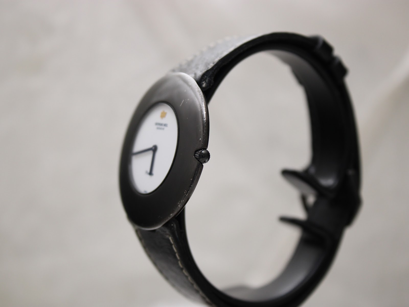 Side angled view of the Raymond Weil Phantôm watch, showing the black case and crown.