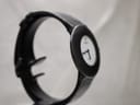 Another side angled view of the Phantôm watch, highlighting the case profile and black leather strap.