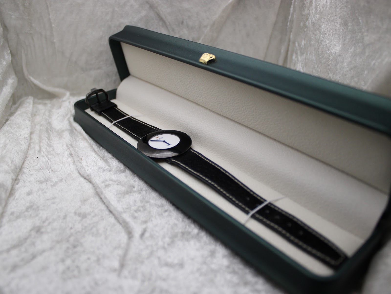 Raymond Weil Phantôm watch displayed inside a green watch presentation box with cream interior.