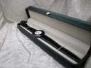 Raymond Weil Phantôm watch displayed inside a green watch presentation box with cream interior.