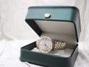 The Certina DS Caimano watch presented open in a dark green watch box with gold trim.