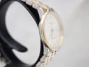 Angled side view of the Certina DS Caimano case, showing the gold-tone bezel and titanium mid-case.
