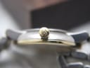 Detailed close-up of the gold-tone crown of the Certina DS Caimano, clearly showing the "DS" logo.