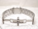 Close-up of the watch's hidden butterfly clasp, made of polished silver-tone metal.