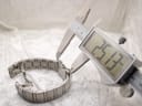 Digital caliper measuring another dimension of the watch bracelet, displaying a reading of 25.13mm.