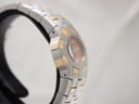 Another side view of the watch, highlighting the integrated two-tone stainless steel bracelet.