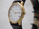 Angled close-up of the gold Certina watch showing the crown and tonneau case profile.