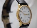 Side view of the gold Certina watch showcasing the elegant tonneau case and clean white dial.