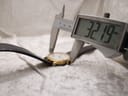 Digital caliper measuring the case diameter of the Certina watch at precisely 32.19mm.