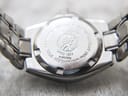 Close-up of the screw-down stainless steel case back, engraved with Tissot emblem, "Since 1853", "P130/230", "Stainless Steel", "Sapphire Crystal", and "Water Resistant 200M".