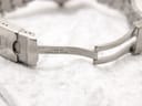 Close-up of the inside of the stainless steel bracelet's signed fold-over clasp, showing "P230-150" and "Stainless Steel" engravings.